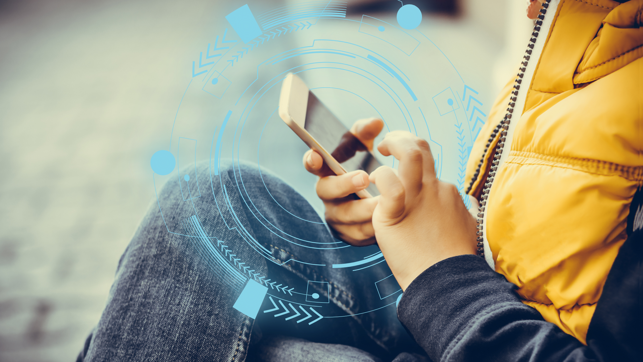Protect your kids from identity theft. Image shows a preteen's hands playing on a cell phone, with a blue cyber security ring around them.